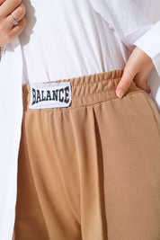 Amira Biscuit Beige Wide-Leg Broek Met Geborduurde Embleem